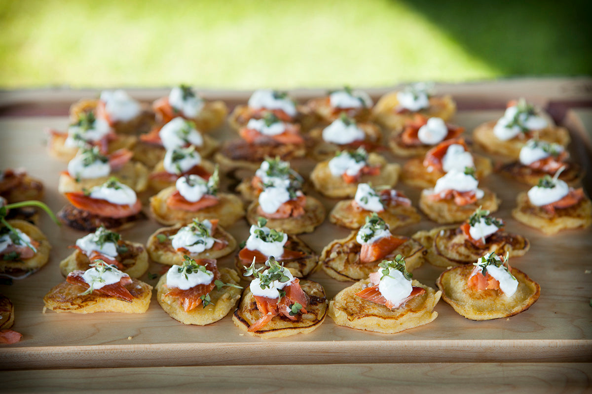 Jackson Hole smoked trout and creme fraiche blinis holiday recipe on serving board