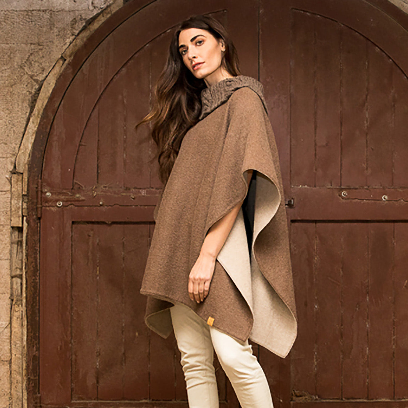 woman-wearing-the-stick-and-ball-womens-apparell-reversible-alpaca-knit-collar-poncho-taupe-beige