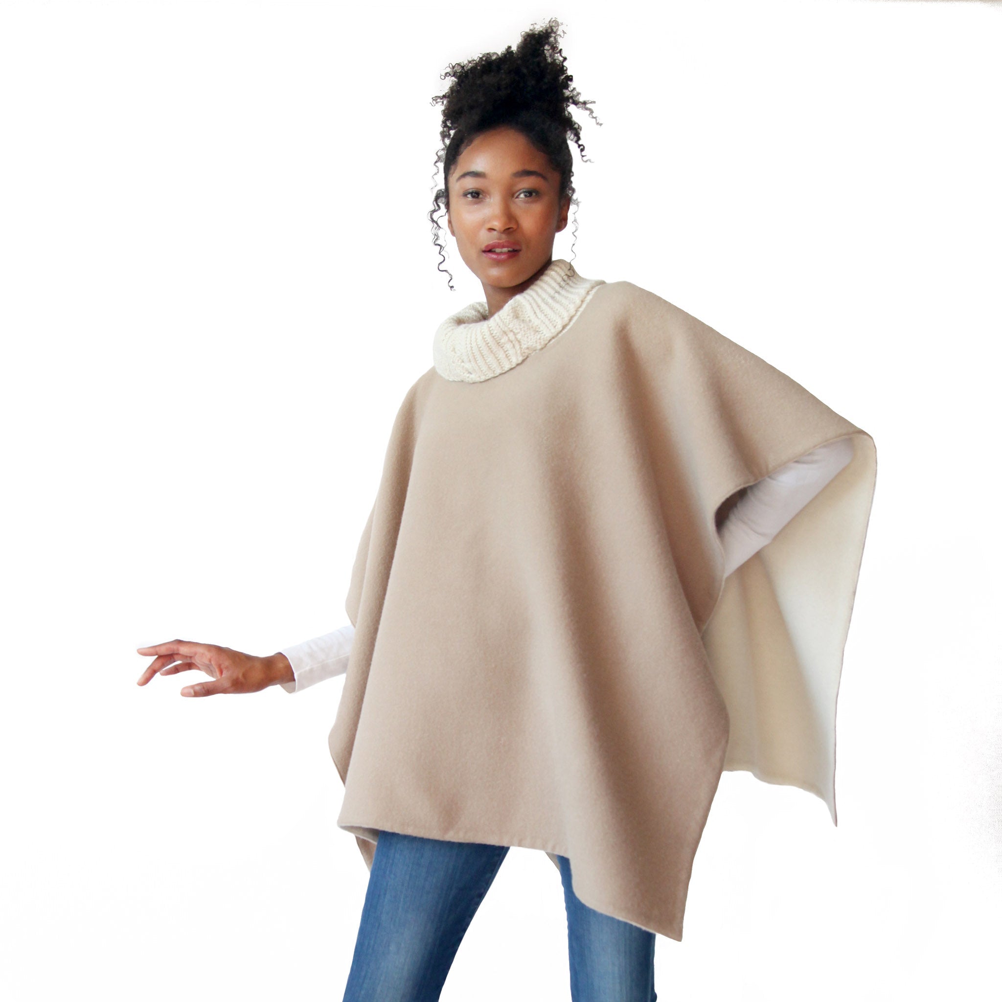 woman-wearing-the-stick-and-ball-womens-apparel-reversible-alpaca-knit-collar-poncho-cream-camel