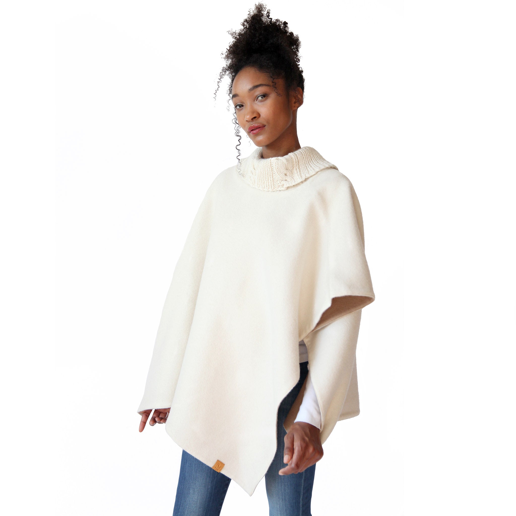woman-wearing-the-stick-and-ball-womens-apparel-reversible-alpaca-knit-collar-poncho-cream-camel