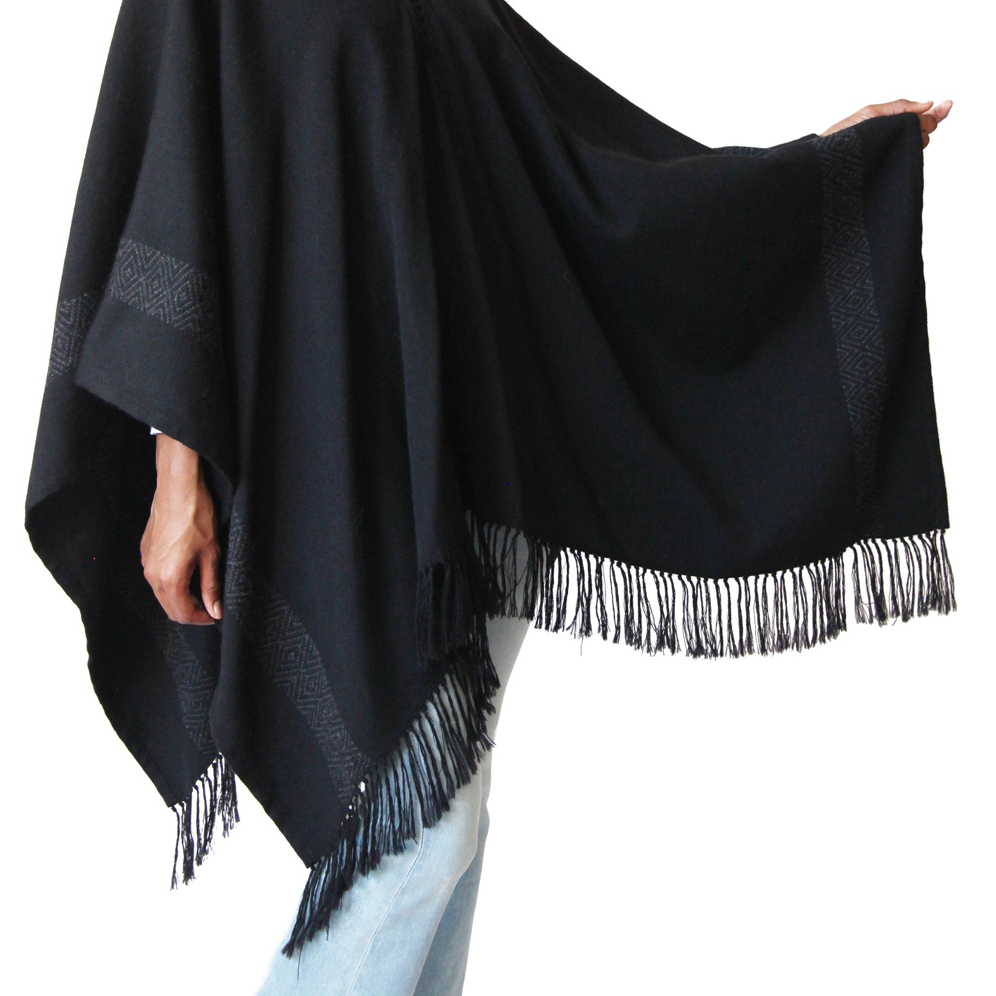 Woman wearing Handwoven Blackout Pilar Alpaca Poncho with fringe design details- Stick & Ball