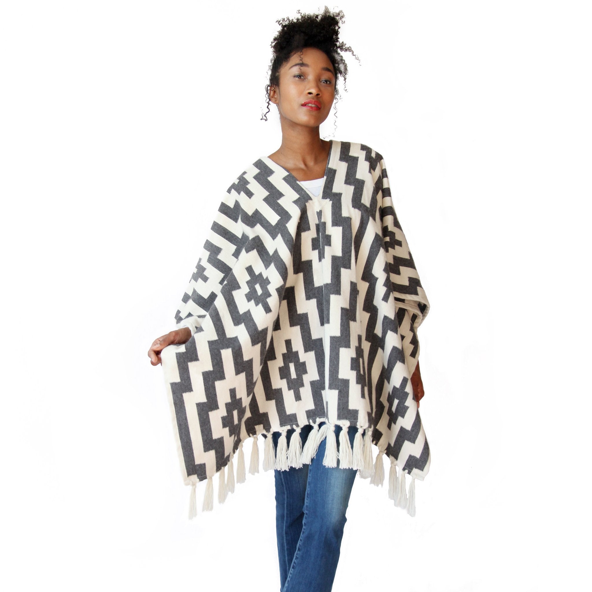woman-wearing-stick-and-ball-apparel-unisex-gaucho-pampa-alpaca-poncho-charcoal-and-ecru