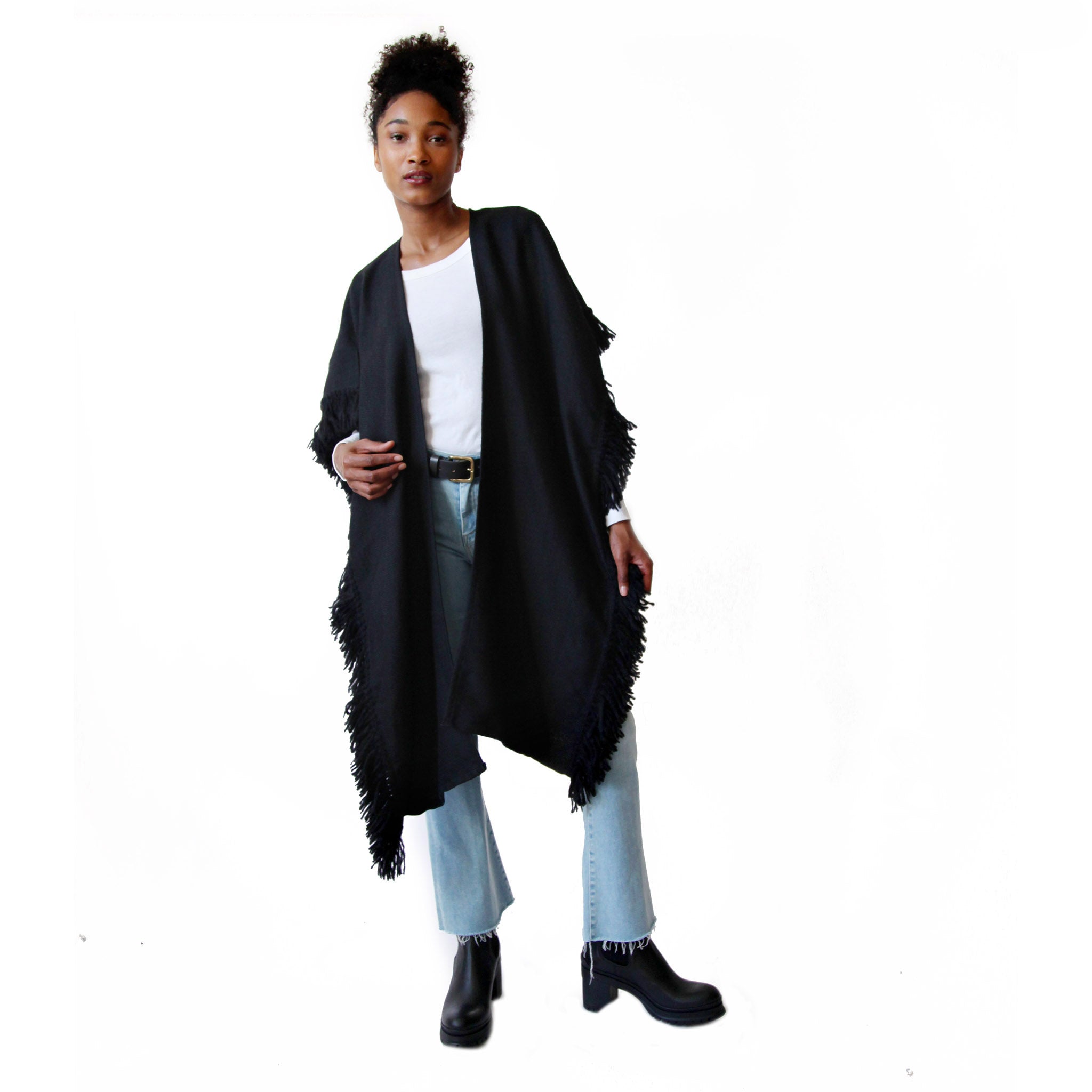 woman-wearing-stick-and-ball-apparel-womens-fringed-alpaca-ruana-wrap-black-with-correntino-belt-in-black
