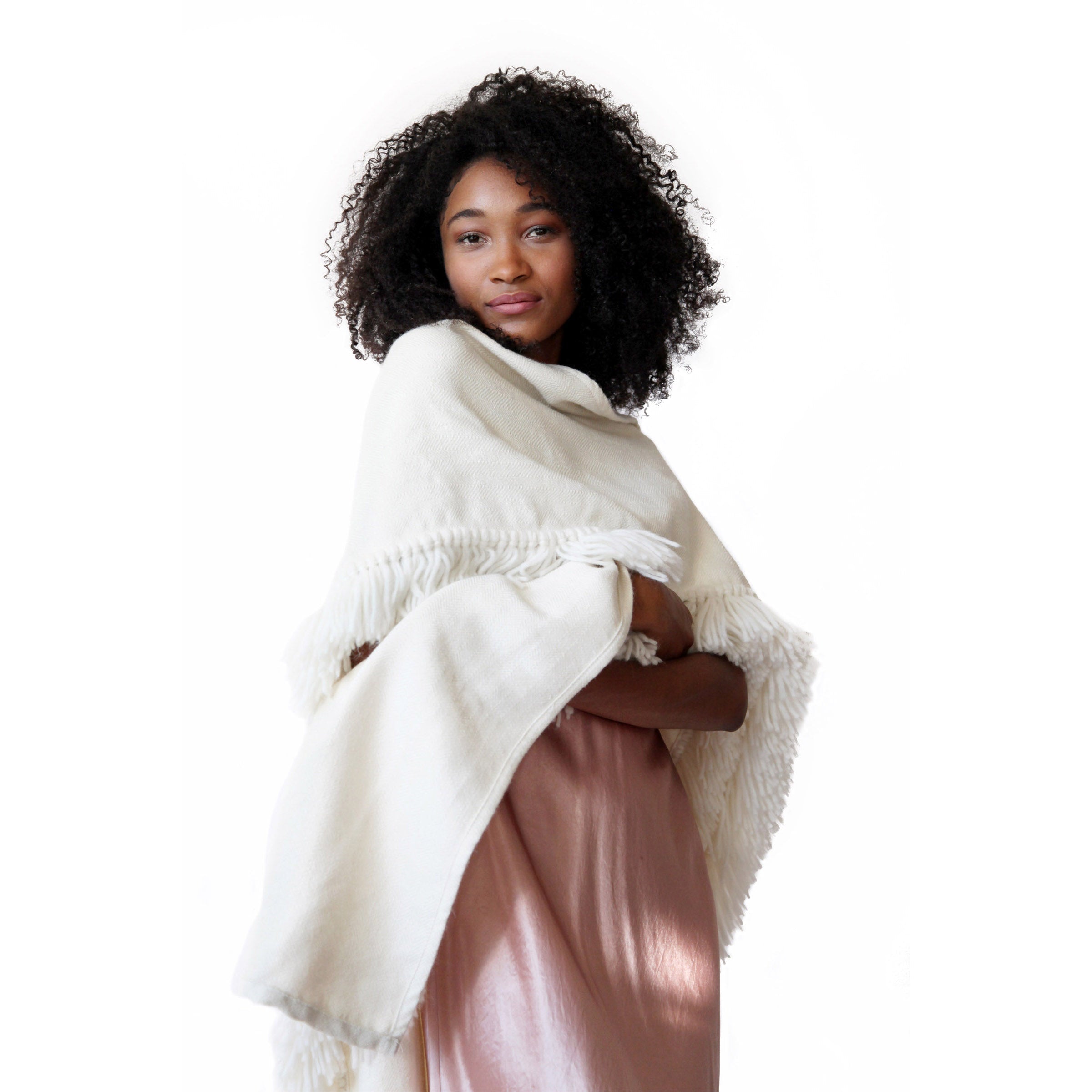 woman-wearing-evening-look-with-stick-and-ball-apparel-womens-fringed-alpaca-ruana-wrap-winter-white
