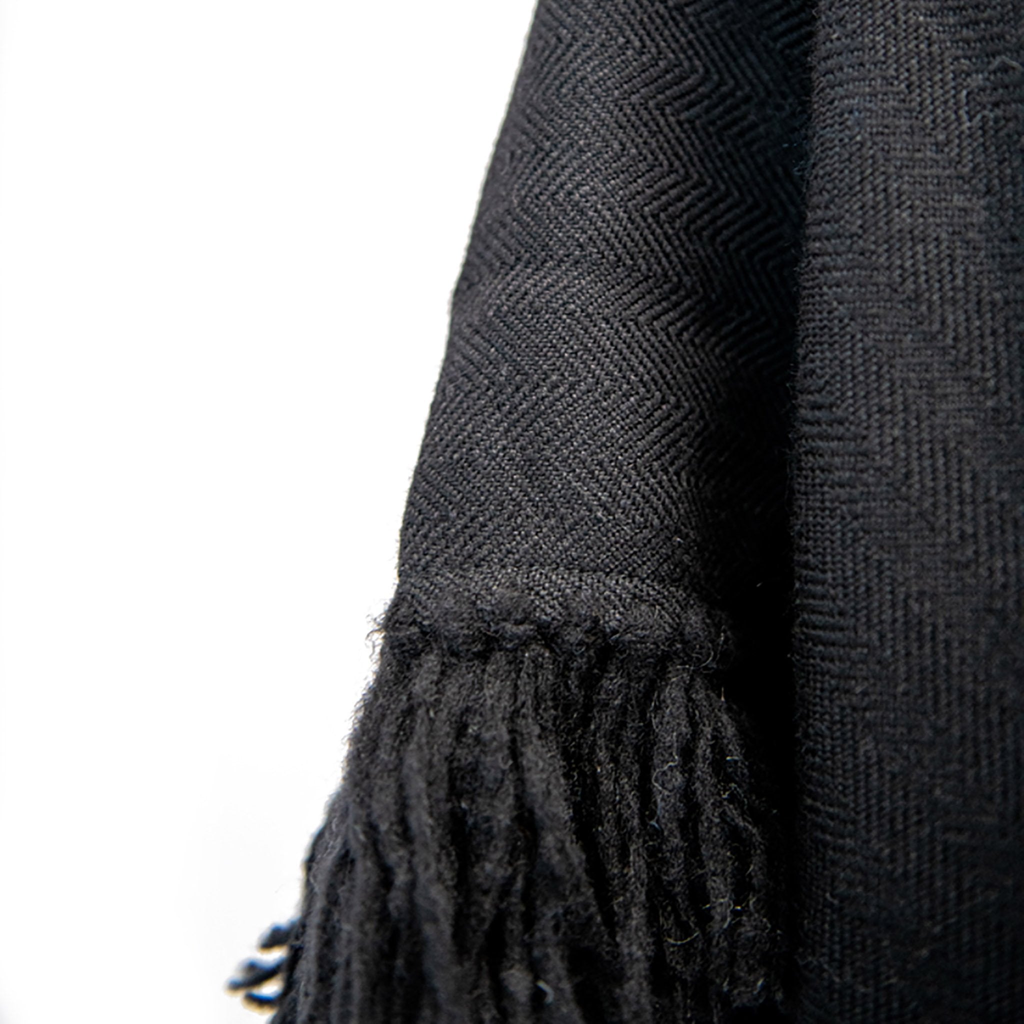 stick-and-ball-apparel-womens-alpaca-poncho-cropped-fringe-black-hand-tied-fringe-detail