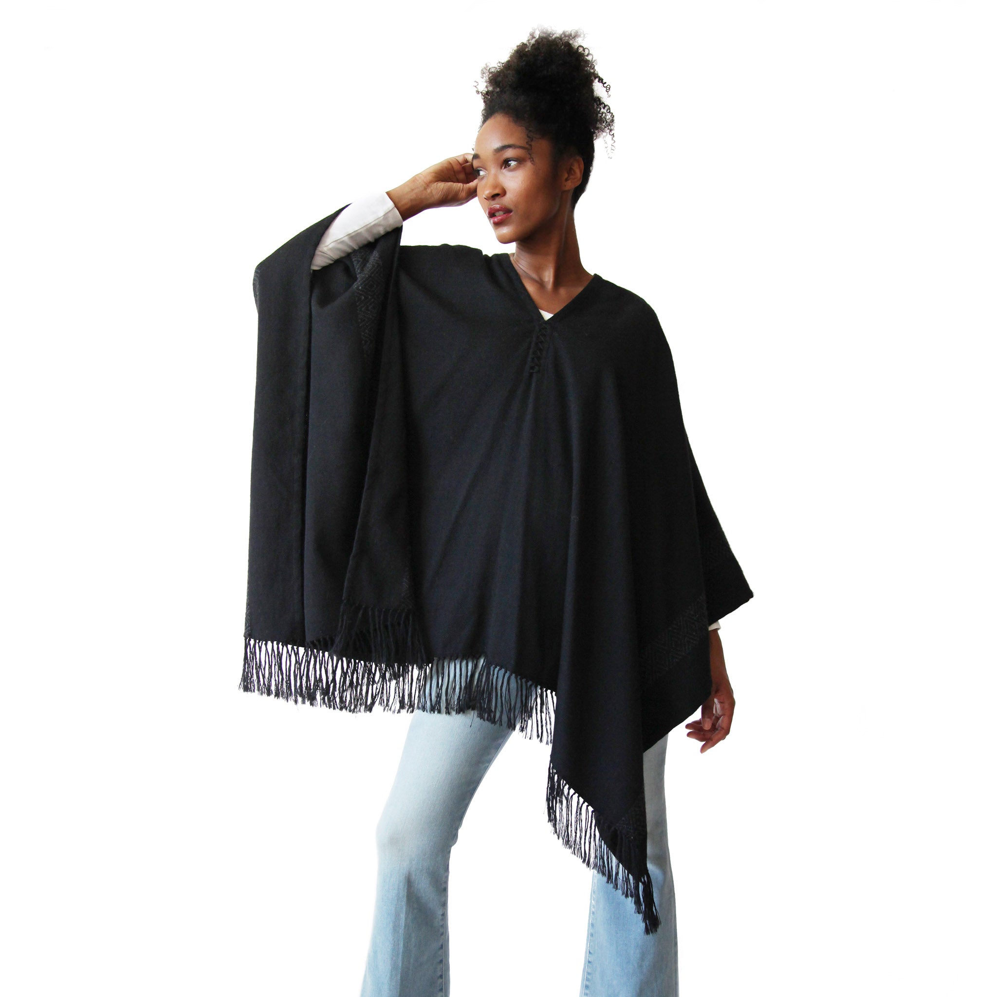 Woman wearing Handwoven Blackout Pilar Alpaca Poncho with fringe - Stick & Ball