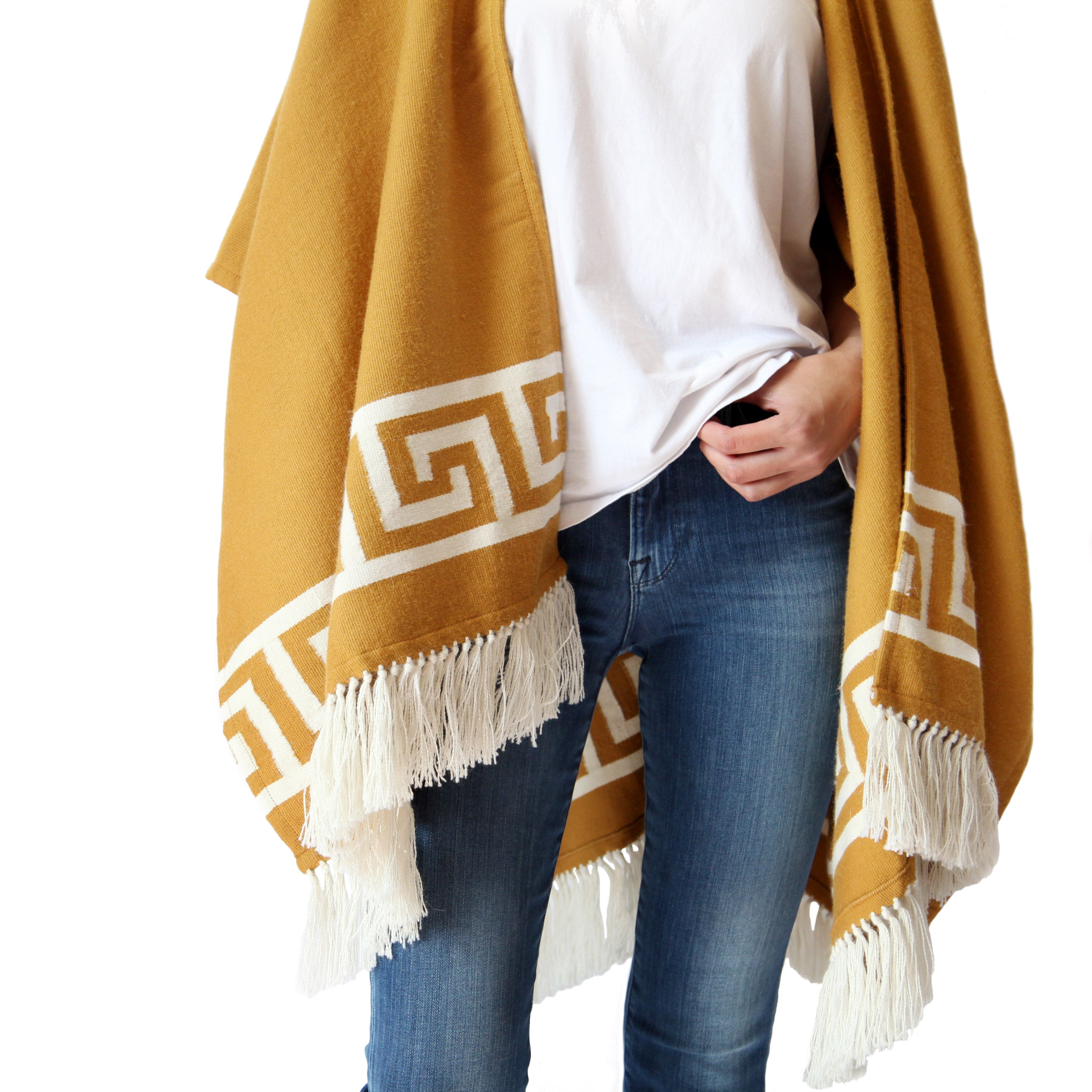 woman-wearing-stick-and-ball-apparel-womens-inca-gold-ruana-wrap