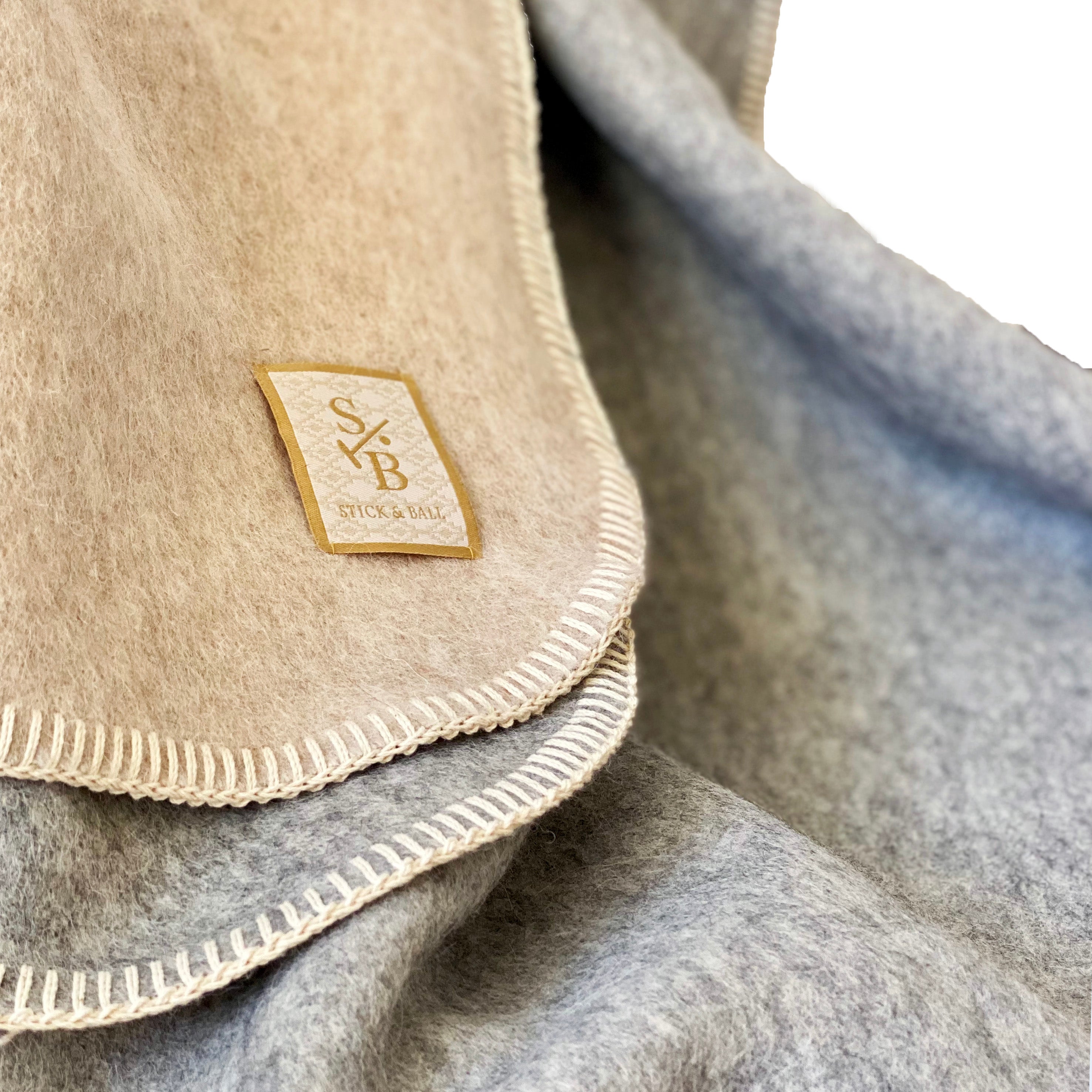 stick-and-ball-home-decor-double-faced-alpaca-throw-with-whipstich-taupe-and-light-grey-stitching-detail