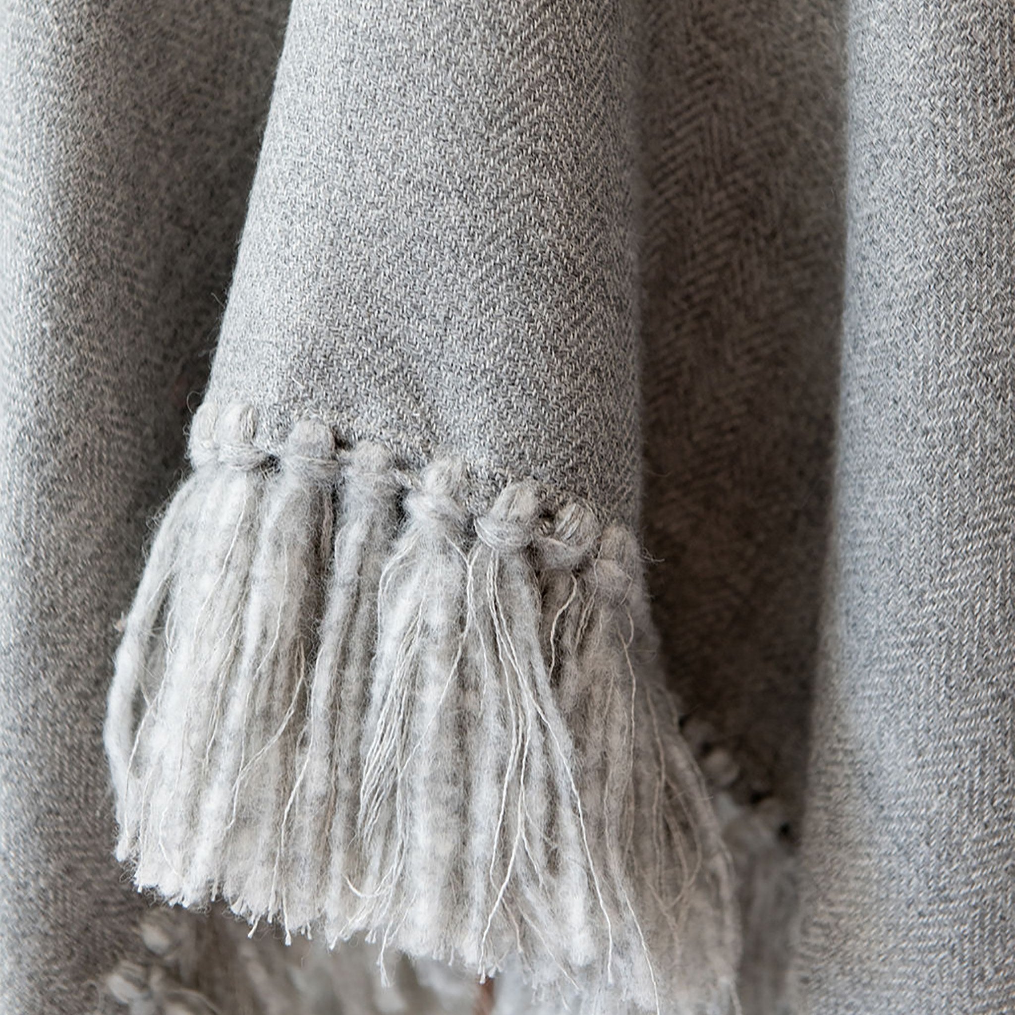 stick-and-ball-apparel-womens-alpaca-poncho-cropped-fringe-light-grey-hand-tied-fringe-detail