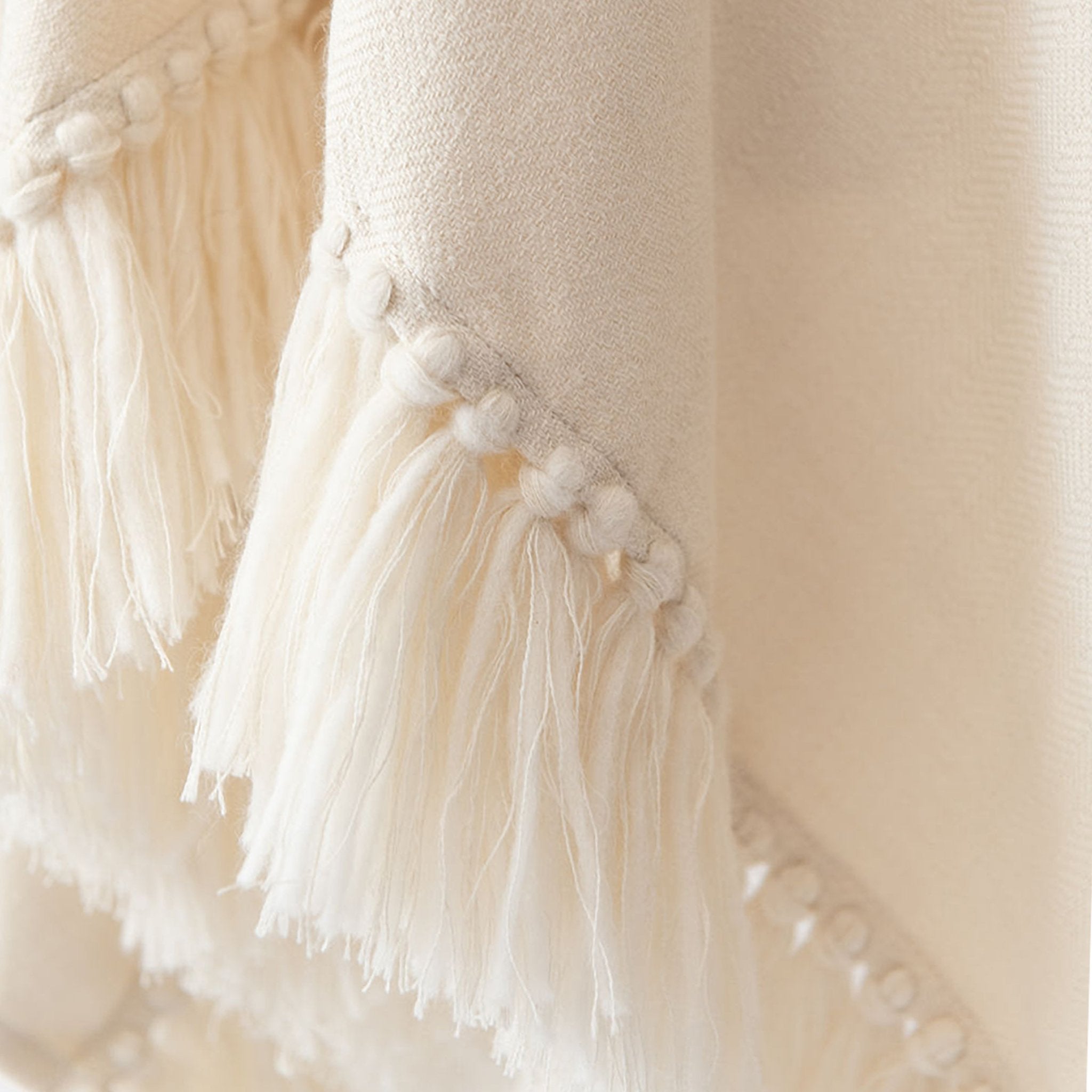 stick-and-ball-apparel-womens-alpaca-poncho-cropped-fringe-winter-white-hand-tied-fringe-detail