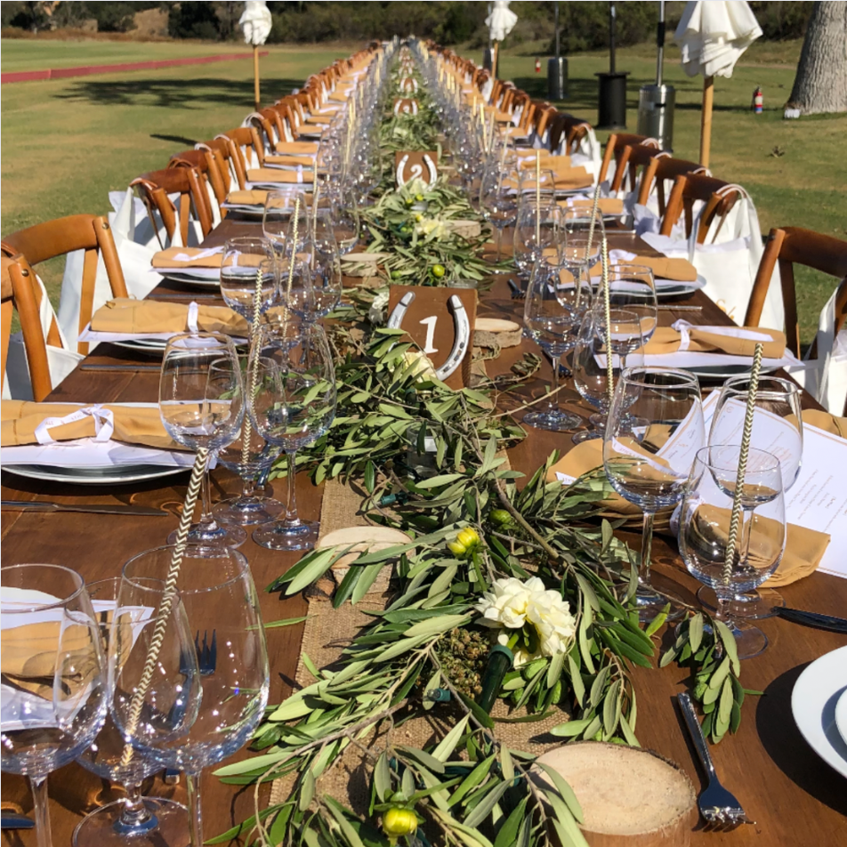 Stick and Ball fieldside asado community dinner table set outdoors at polo event
