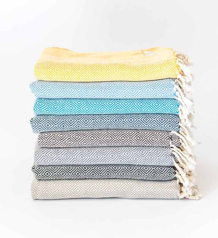 Collection image for Turkish Cotton Scarves & Wraps - a stack of multi colored diamond woven cotton scarves