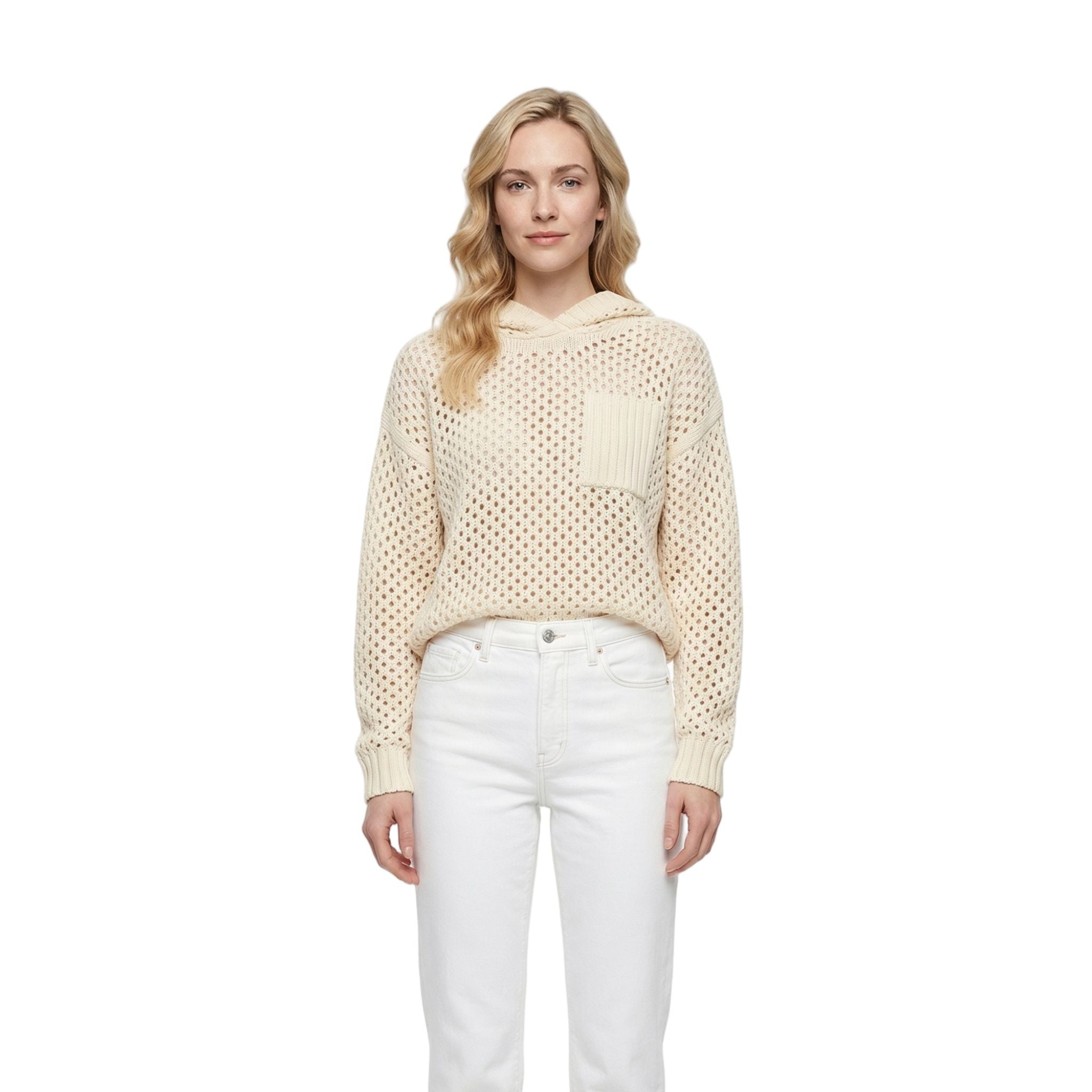 Woman wearing a beige knitted sweater and white pants on a white background