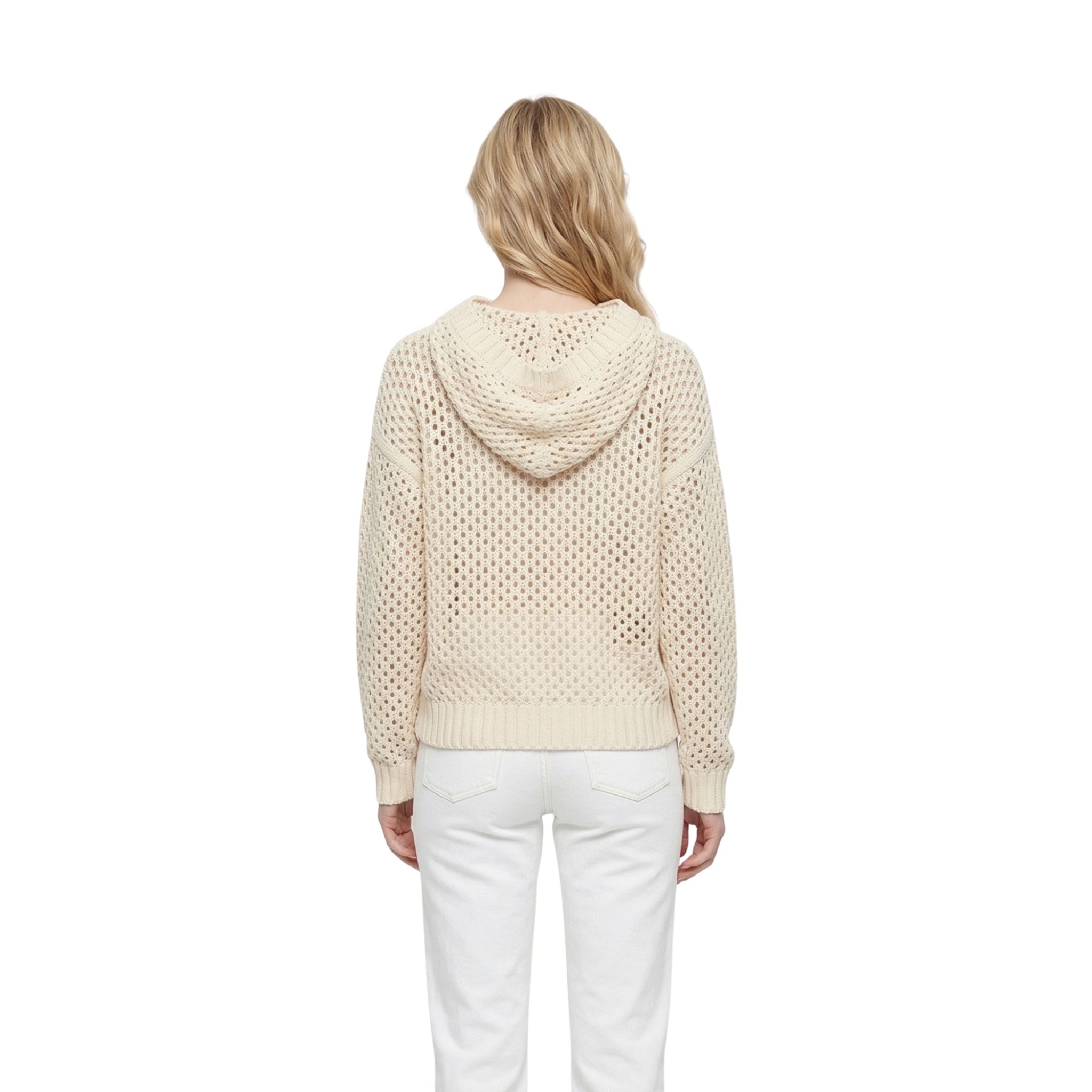 Woman wearing a beige knitted hoodie on a white background