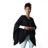 Woman wearing Handwoven Cropped Fringe Alpaca Poncho with fringe - Black - Stick & Ball