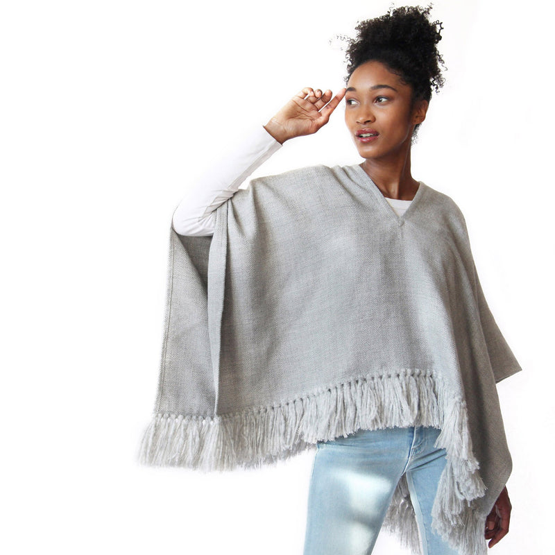 Woman wearing Handwoven Cropped Fringe Alpaca Poncho with fringe - Light Grey - Stick & Ball