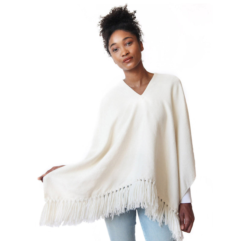 Woman wearing Handwoven Cropped Fringe Alpaca Poncho with fringe - Winter White/Cream, Stick & Ball