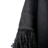 Herringbone hand-weave and hand-tied fringe from Cropped Fringe Alpaca Poncho - Black - Stick & Ball