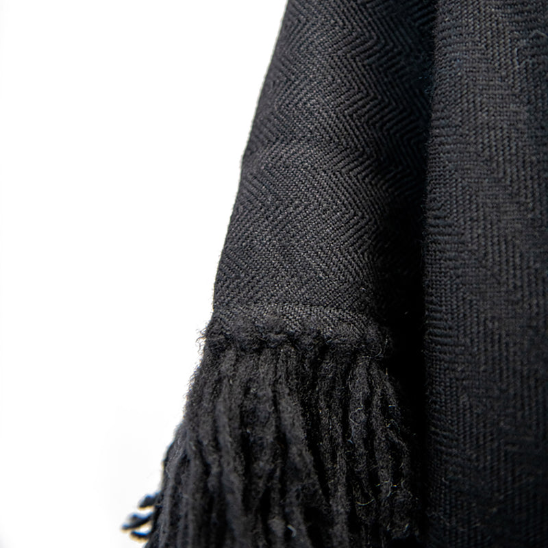 Herringbone hand-weave and hand-tied details of Long Fringed Alpaca Poncho in Black - Stick & Ball 