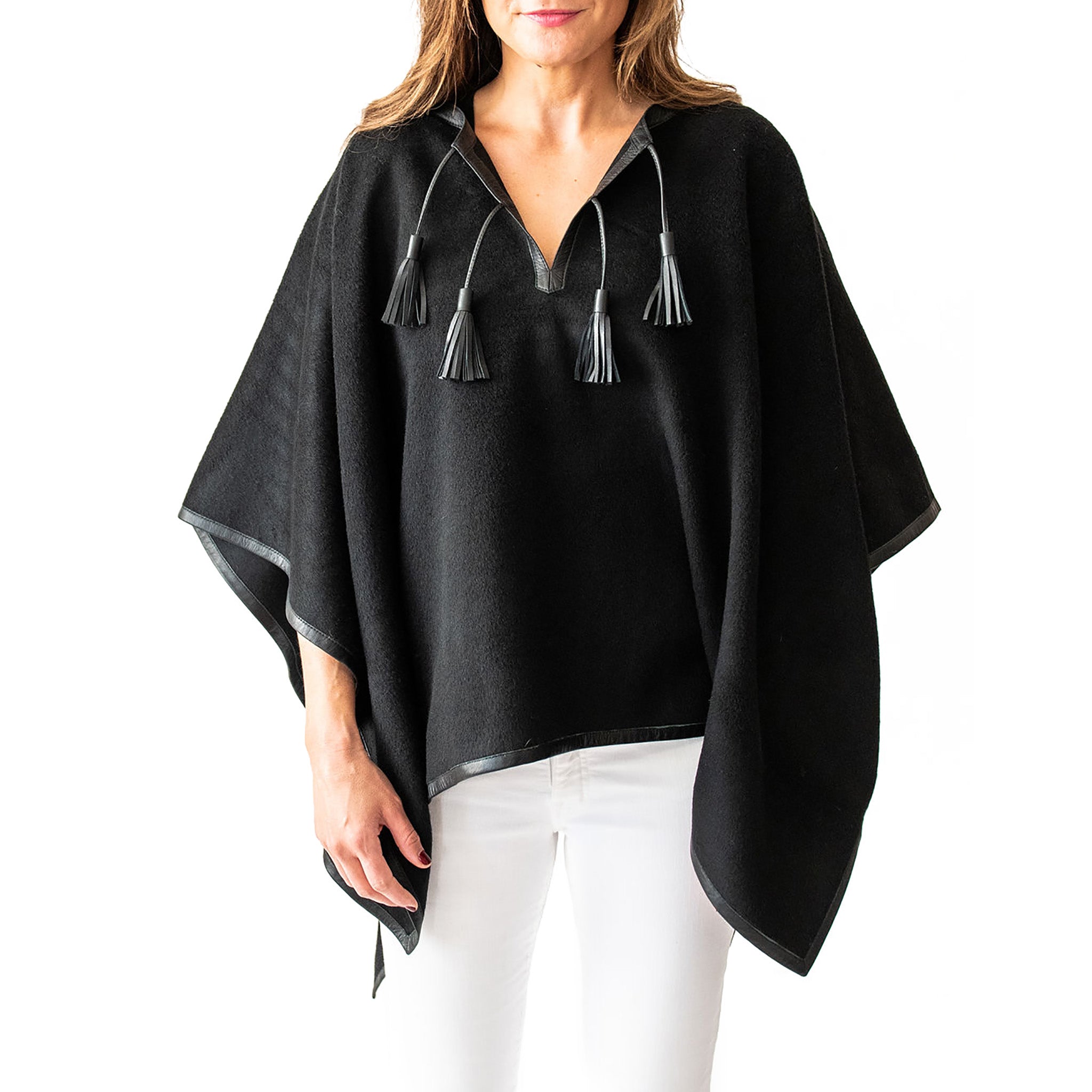 Woman wearing Italian Leather Trim Tassel Alpaca Poncho - Black, front side - Stick & Ball  