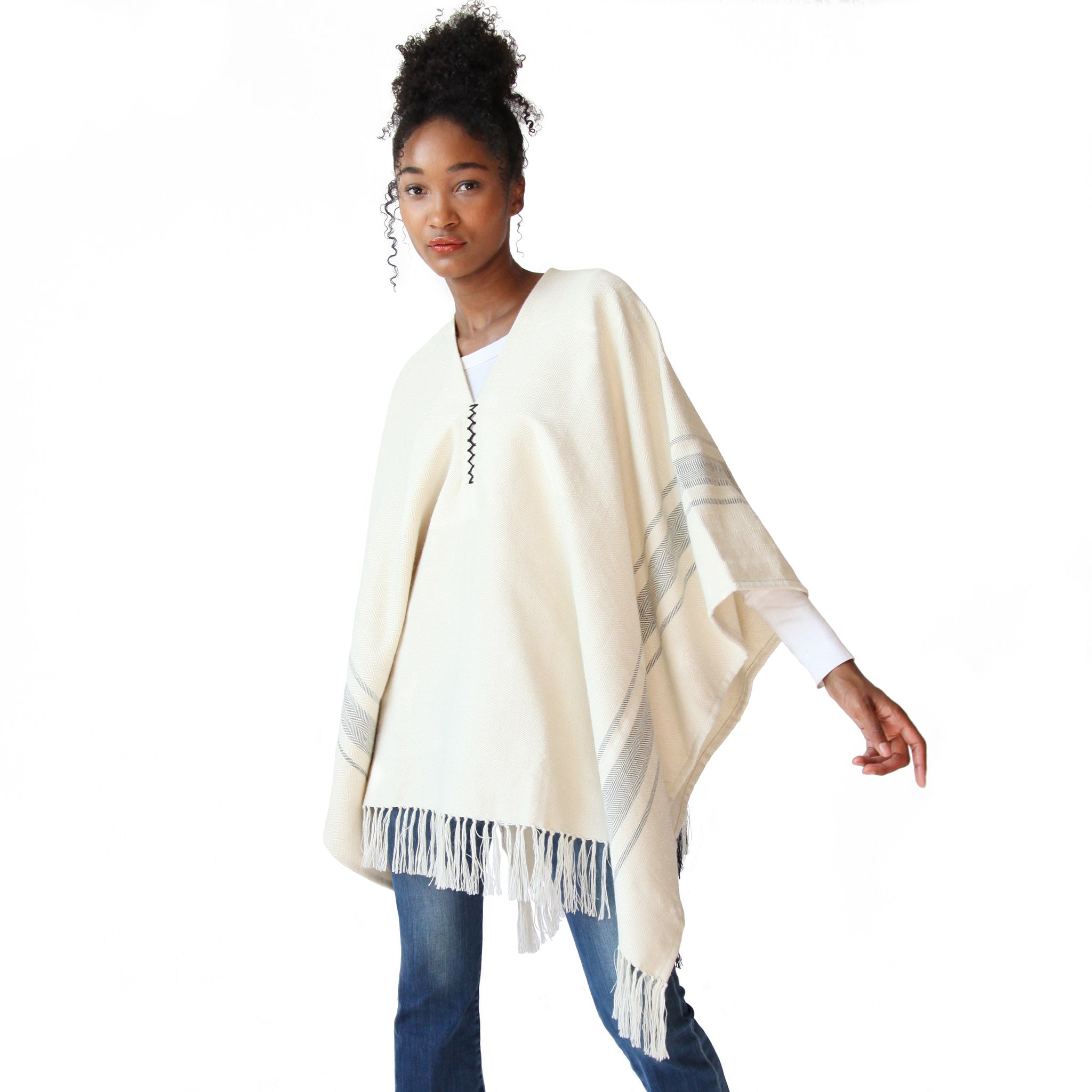 woman-wearing-stick-and-ball-apparel-unisex-alpaca-poncho-camilo-white-black