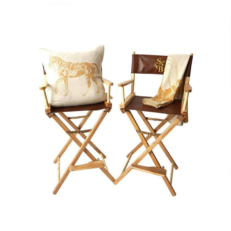 Two Bar Height Director's Chairs with Stick & Ball Logo with Polo Pony Pillow and Throw on top